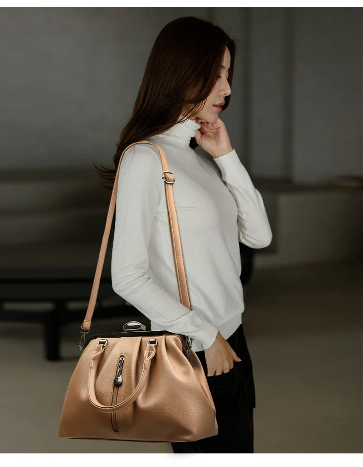 Stylish woman showcasing a high quality PU leather handbag with a sleek design and adjustable strap