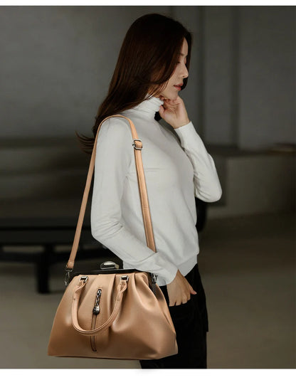 Stylish woman showcasing a high quality PU leather handbag with a sleek design and adjustable strap