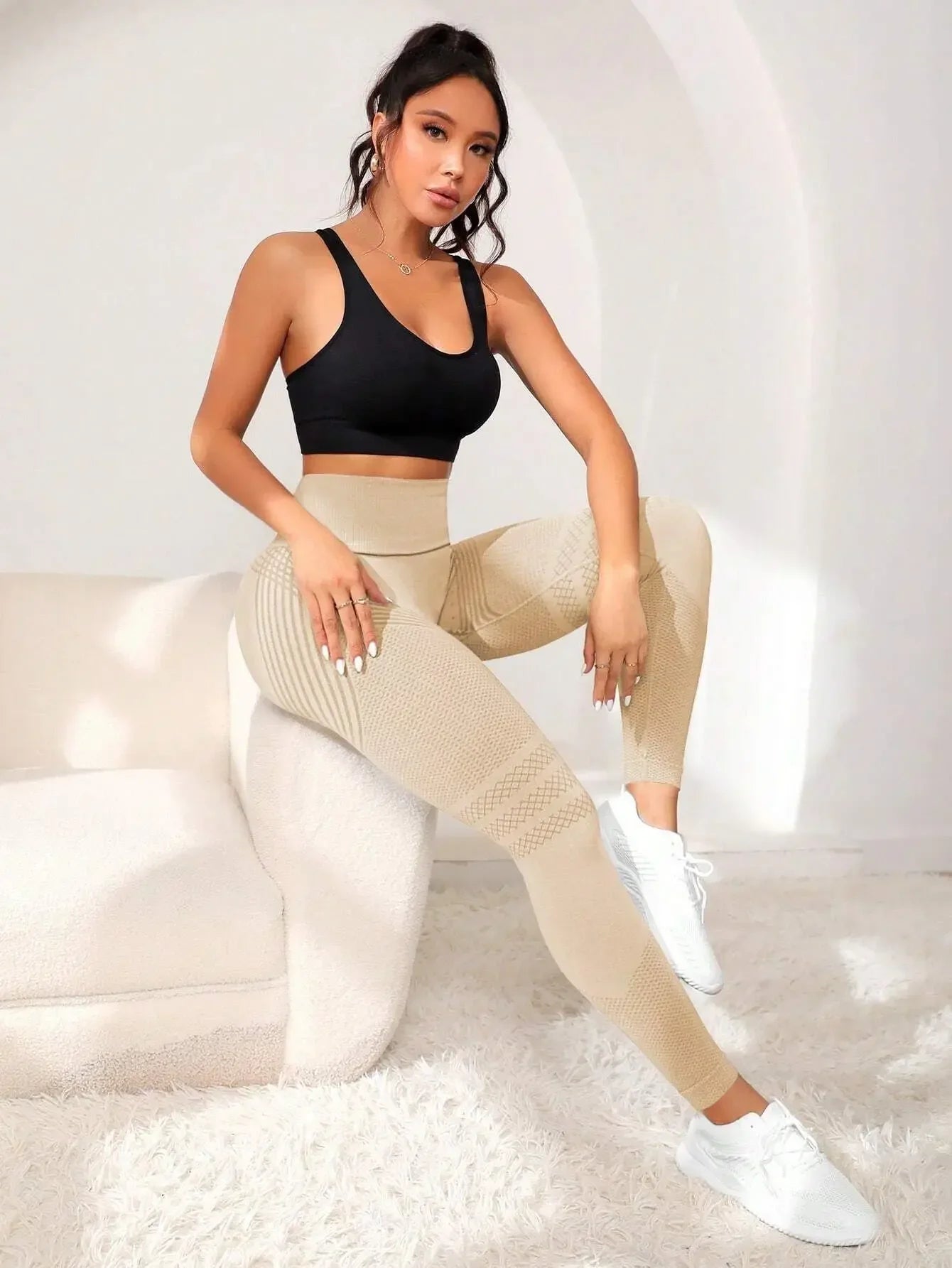 Stylish VaultHaus high waist gym tights in beige paired with a black sports bra for workouts