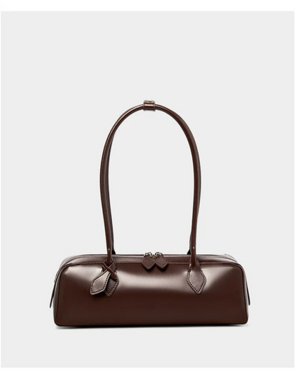 Stylish brown ladies baguette shoulder bag with elegant design and curved handle