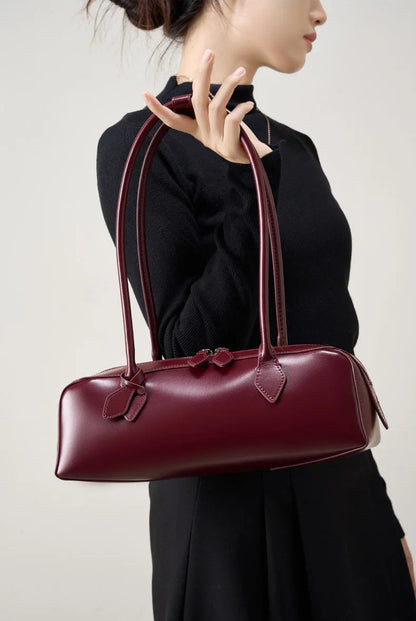 Elegant ladies baguette shoulder bag in burgundy with a classic diamond style for everyday use