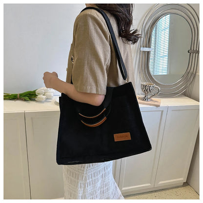 Stylish large capacity canvas handbag from VaultHaus with a sleek design and comfortable shoulder straps