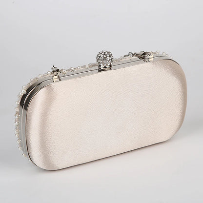 VaultHaus pearl embellished evening clutch bag in ivory with silver frame and decorative clasp