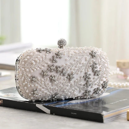VaultHaus pearl embellished evening clutch bag with intricate bead and crystal details on white fabric