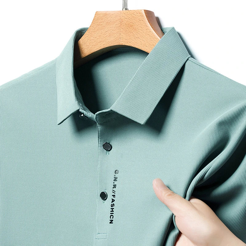 VaultHaus solid color polo shirt for men in light green fabric with a classic collar and button detail
