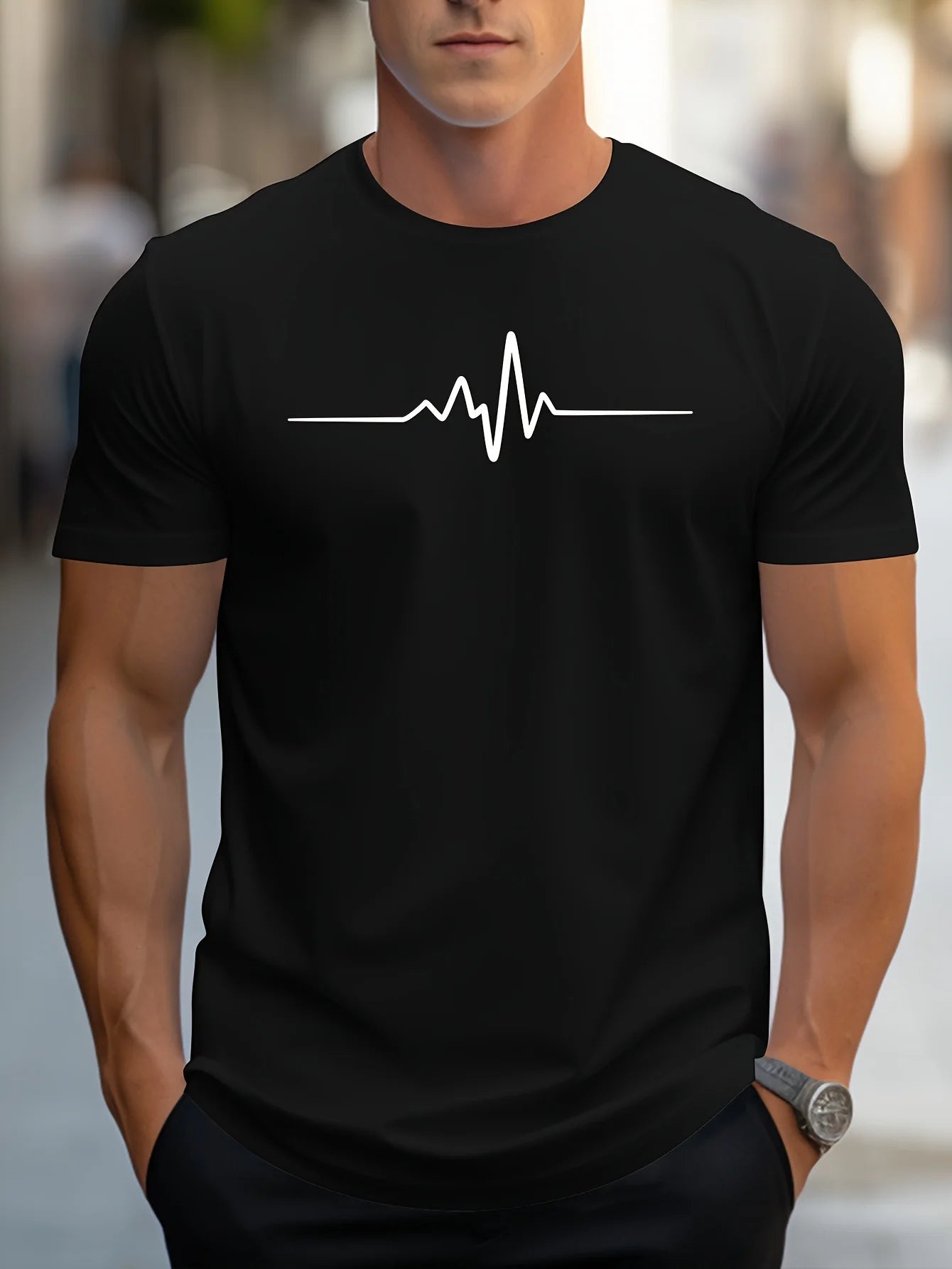 Men's cotton graphic t-shirt in black featuring a minimal heartbeat design across the chest