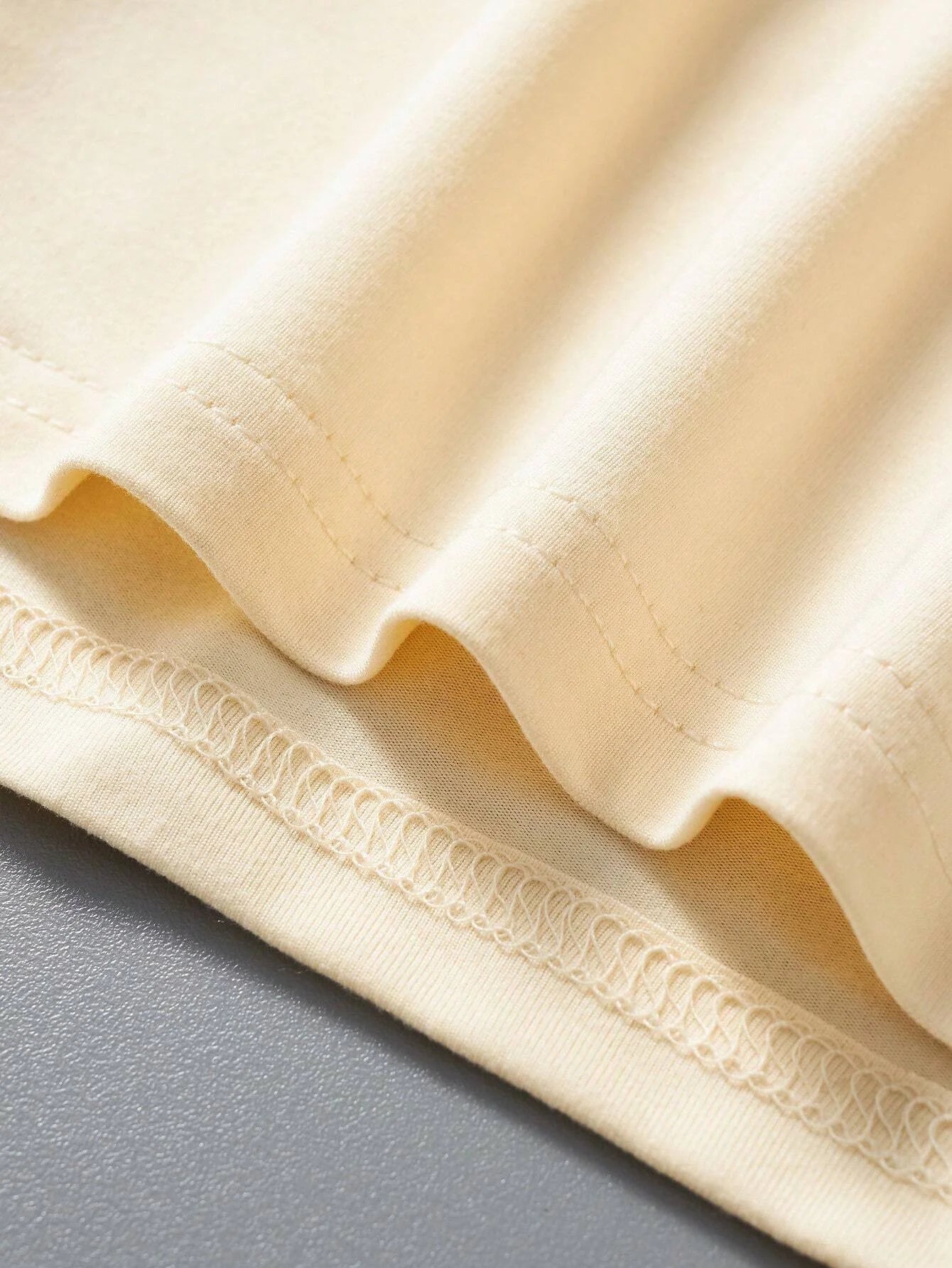Close-up of soft fabric showcasing the men's cotton summer graphic print bear t-shirt's smooth texture