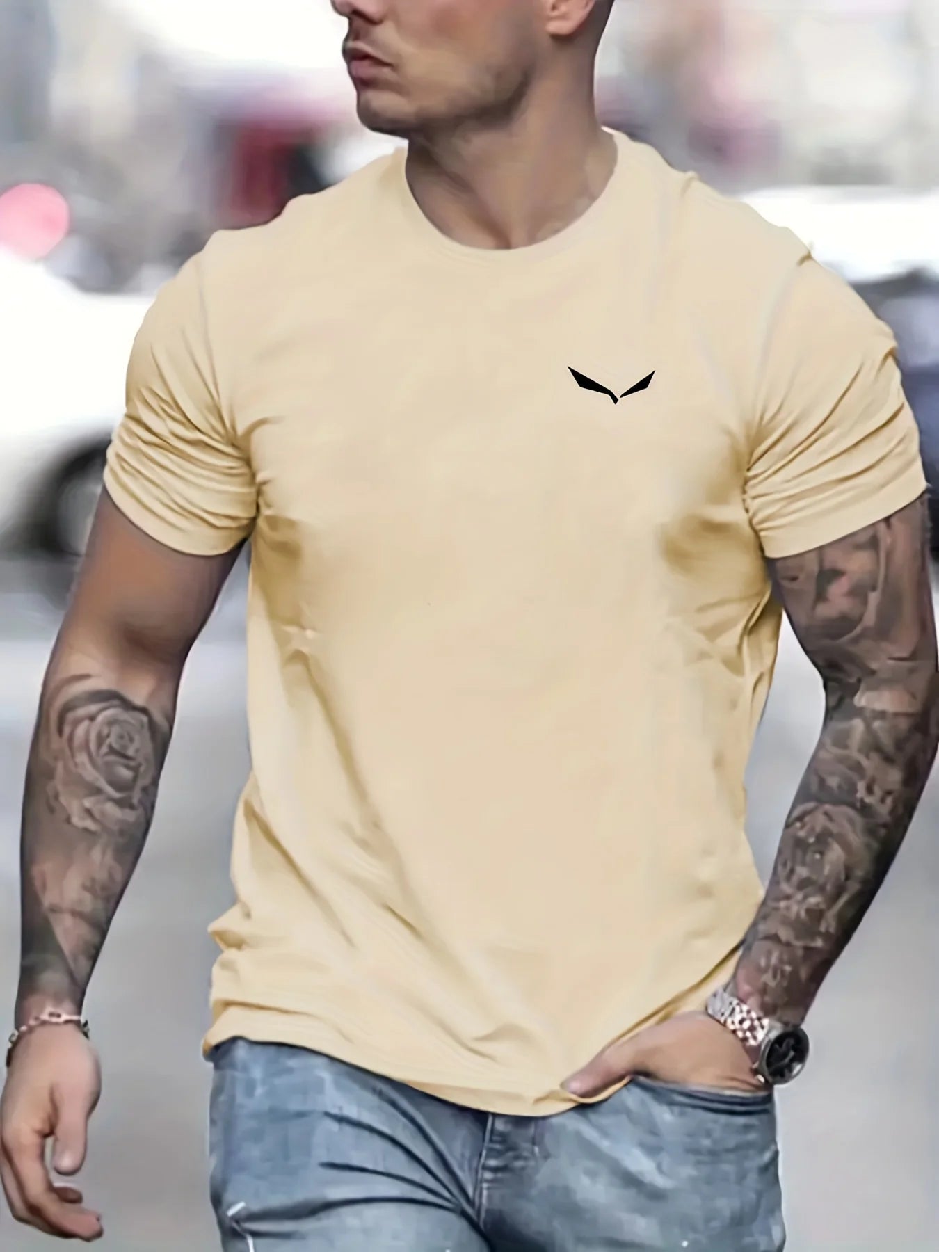 Stylish man wearing a light yellow men's summer cotton t-shirt with a sleek logo for casual wear