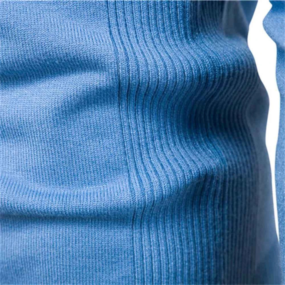 Close-up of a soft blue men's winter pullover sweater showcasing ribbed texture