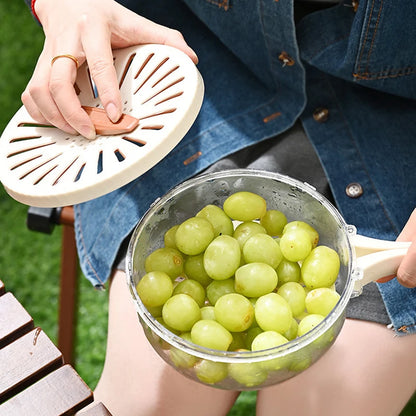 VaultHaus multi-function fruit and vegetable strainer basket with green grapes and lid held by person
