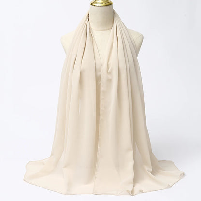 Elegant Cream Muslim Chiffon Hijab Scarf Draped on a Mannequin for Modest Fashion
