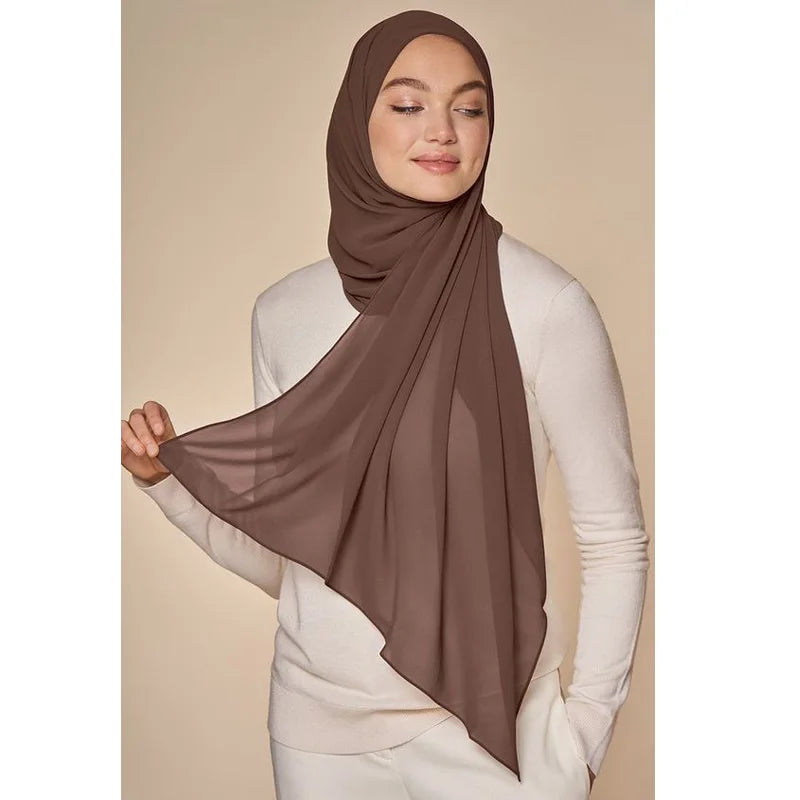 Elegant brown muslim chiffon hijab scarf styled for a sophisticated look with soft draping fabric
