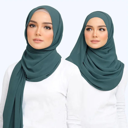 Muslim chiffon hijab scarf in teal worn elegantly by a model with a simple white top