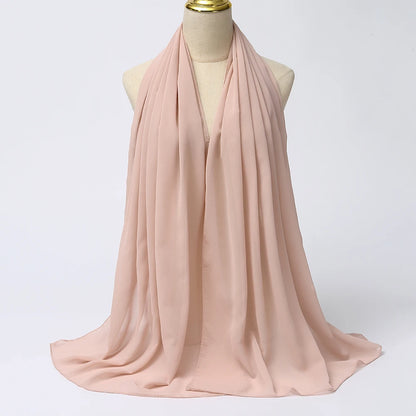 Soft pink VaultHaus muslim chiffon hijab scarf draped elegantly on a mannequin