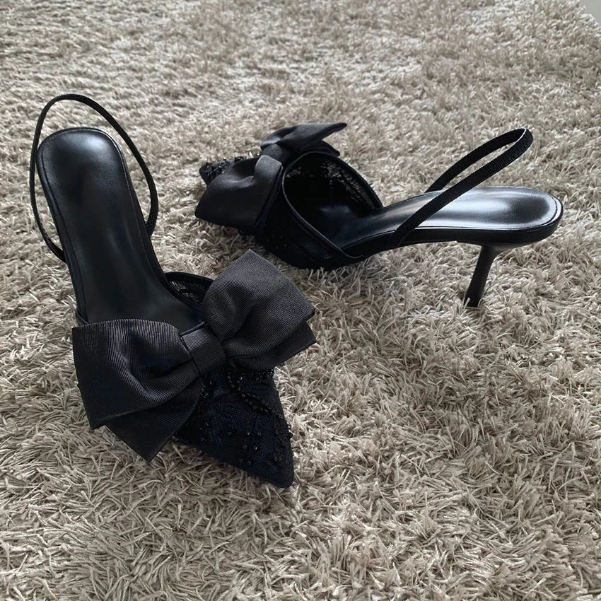 Black mesh embroidered high heels with bow featuring elegant design for stylish occasions
