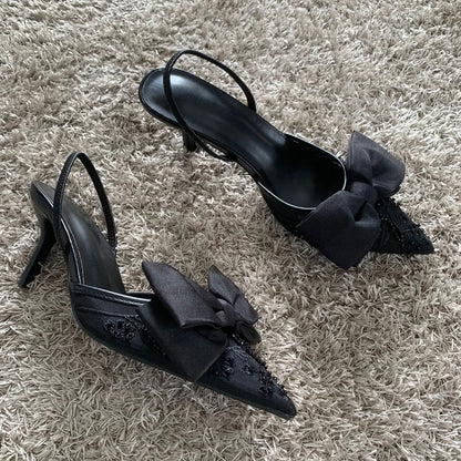 Black mesh embroidered high heels with bow featuring elegant design and stylish pointed toe