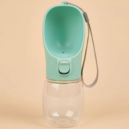 VaultHaus portable dog water bottle in mint green with attached wrist strap for easy carrying