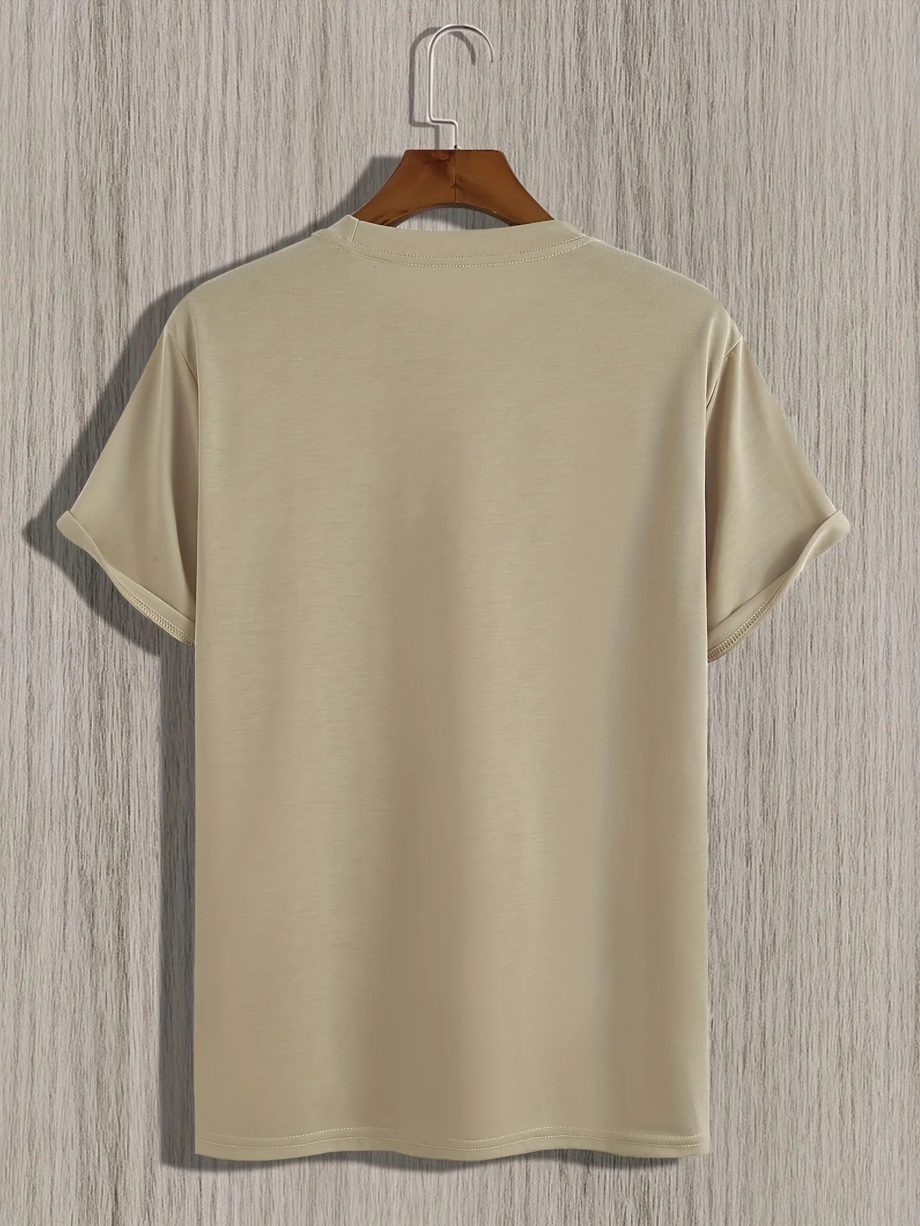 Back view of a beige summer cotton slim fit tee hanging on a wooden hanger