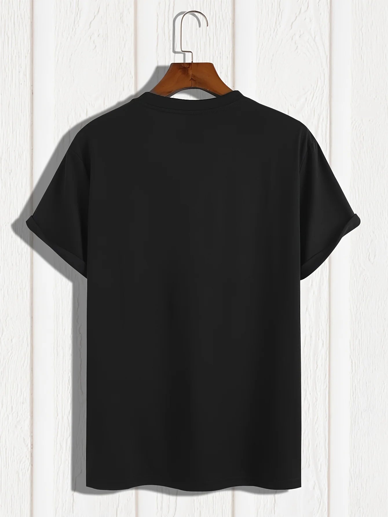 Back view of a black summer cotton slim fit tee hanging on a wooden hanger