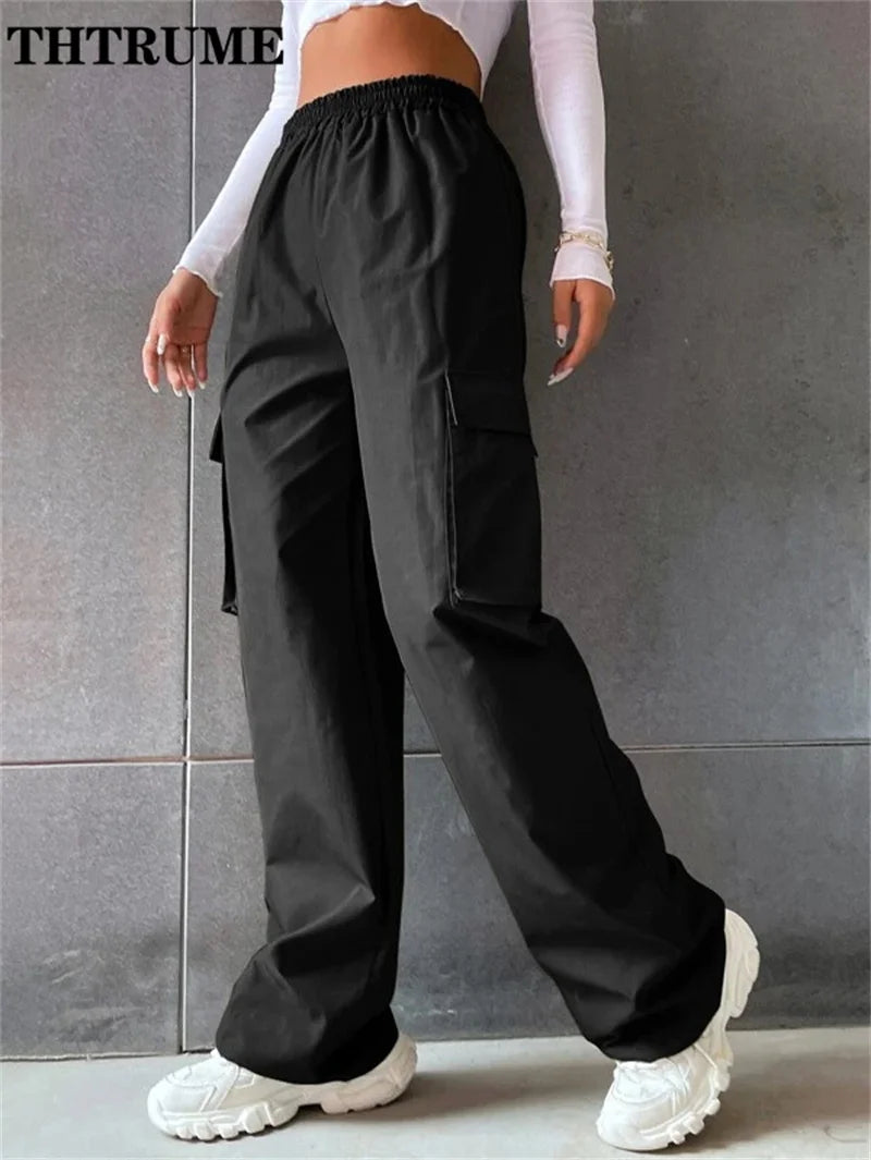 Black vintage streetwear cargo pants with an elastic waistband and side pockets for comfort and style