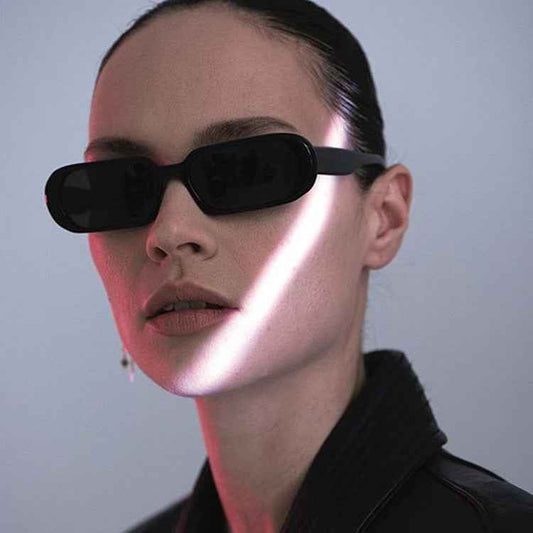 VaultHaus model wearing matte black Retro Small Frame Sunglasses . Slim rectangular lenses modern vintage style