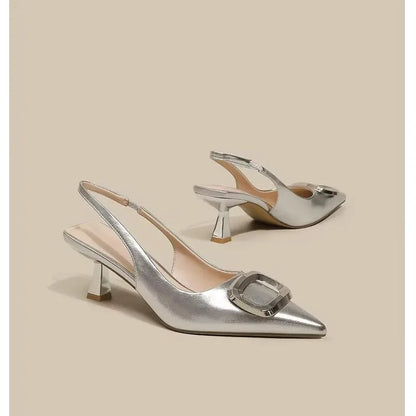 Stylish silver elegant slingback shoes with a chic pointed toe and unique heel design