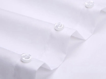 Close-up of white long sleeve anti-wrinkle office shirt with button detailing for a polished look