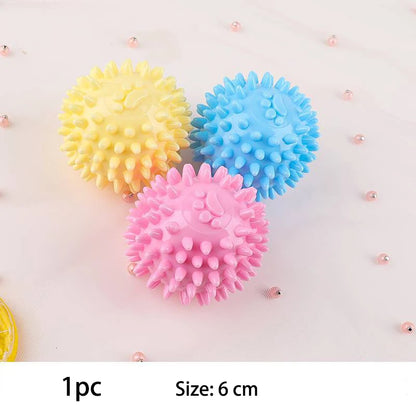 Colorful spiky small dog chew toys in yellow, blue, and pink for playful pups