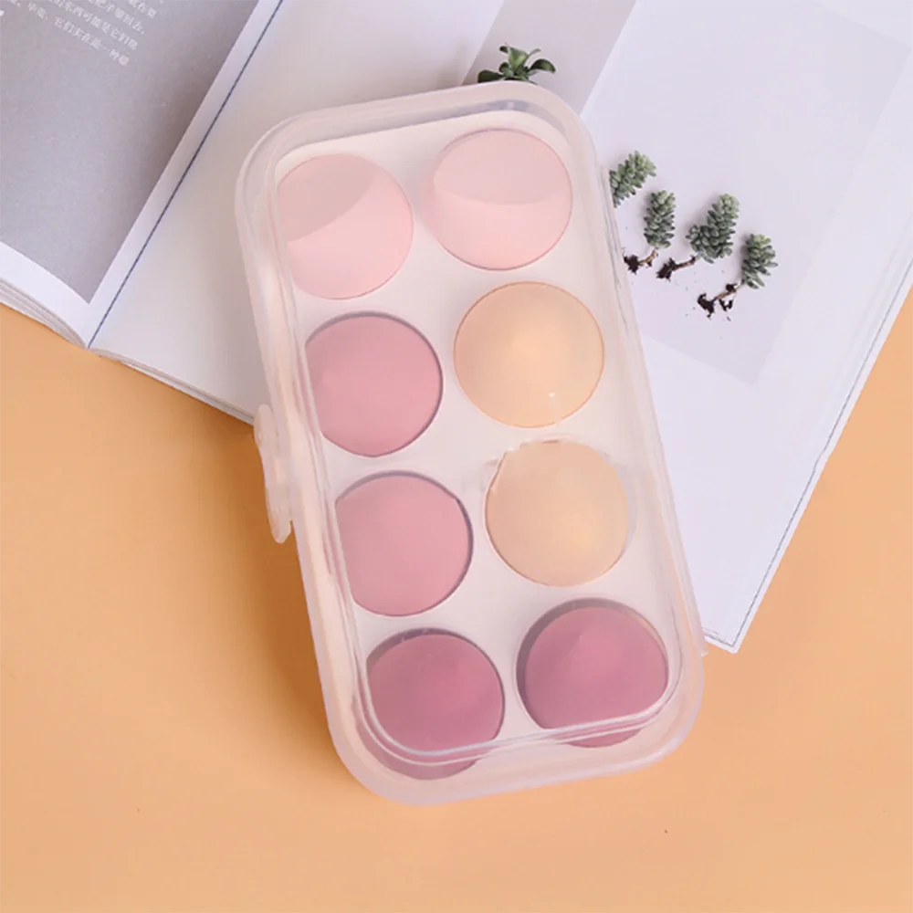 Soft makeup sponge set in a storage case featuring eight pastel-colored sponges for flawless application