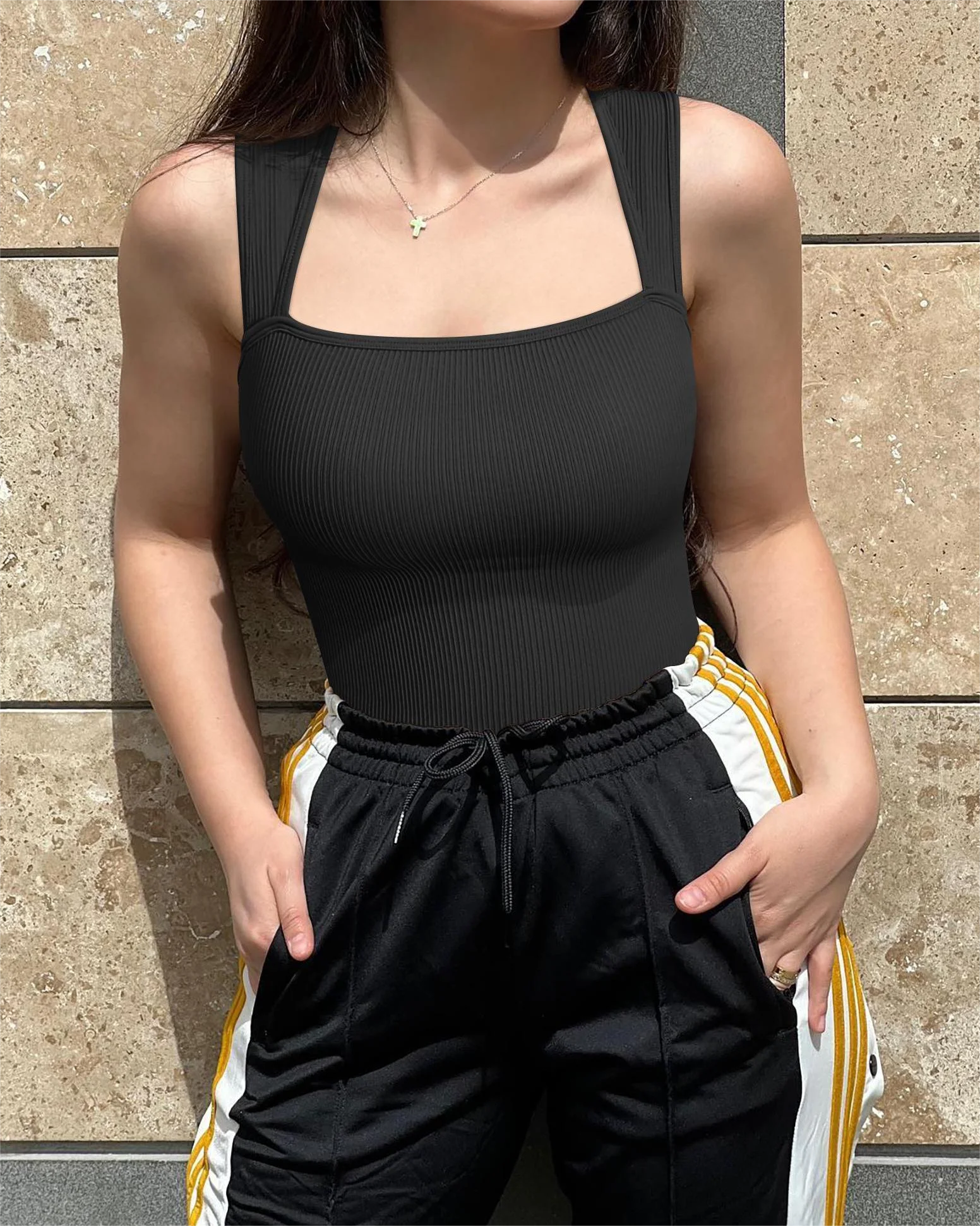 Black solid color summer bodysuit with ribbed texture and wide straps for a trendy look