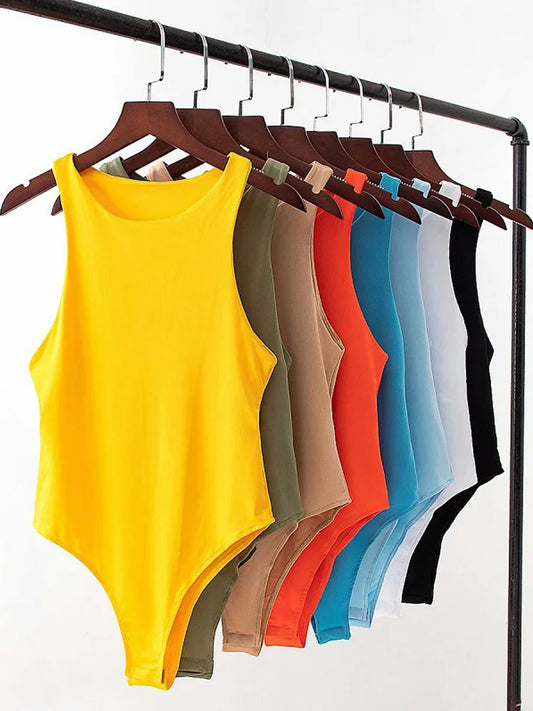 Colorful collection of summer slim bodysuits in various shades hanging on display rack
