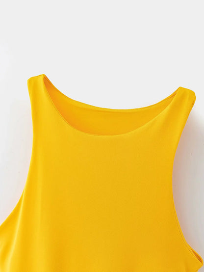 Close-up of a vibrant yellow summer slim bodysuit with a round neckline for stylish summer wear