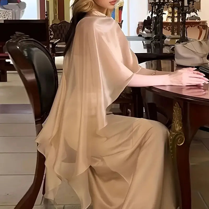 Elegant women's chiffon overlay cape in soft beige, perfect for adding layers to any outfit