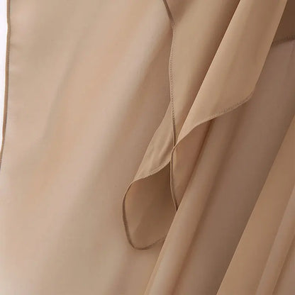 Elegant women's chiffon overlay cape in soft beige, perfect for layering and enhancing outfits