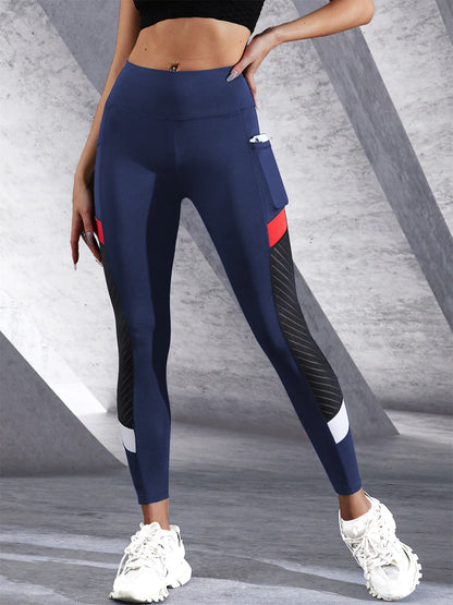 Women's colorblocked mesh leggings in navy with side pockets for active lifestyle and workout comfort