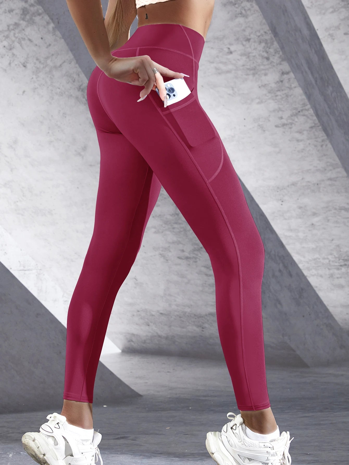 Women's leggings with pockets in deep burgundy for stylish comfort and convenience during workouts