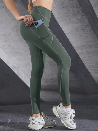 VaultHaus women's leggings with pockets in green, featuring a side pocket for convenience
