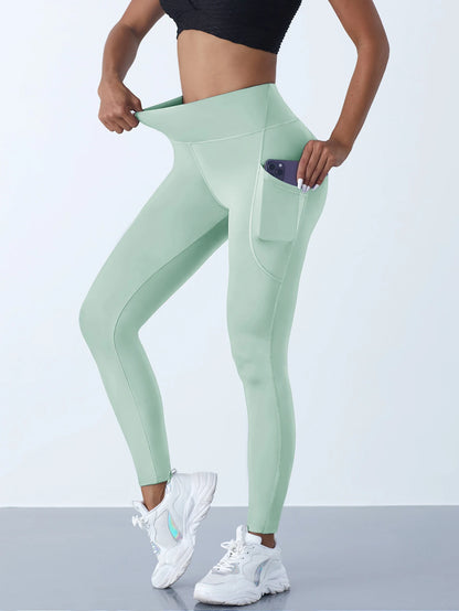 VaultHaus women's leggings with pockets in mint green featuring a high waistband and side pocket for convenience