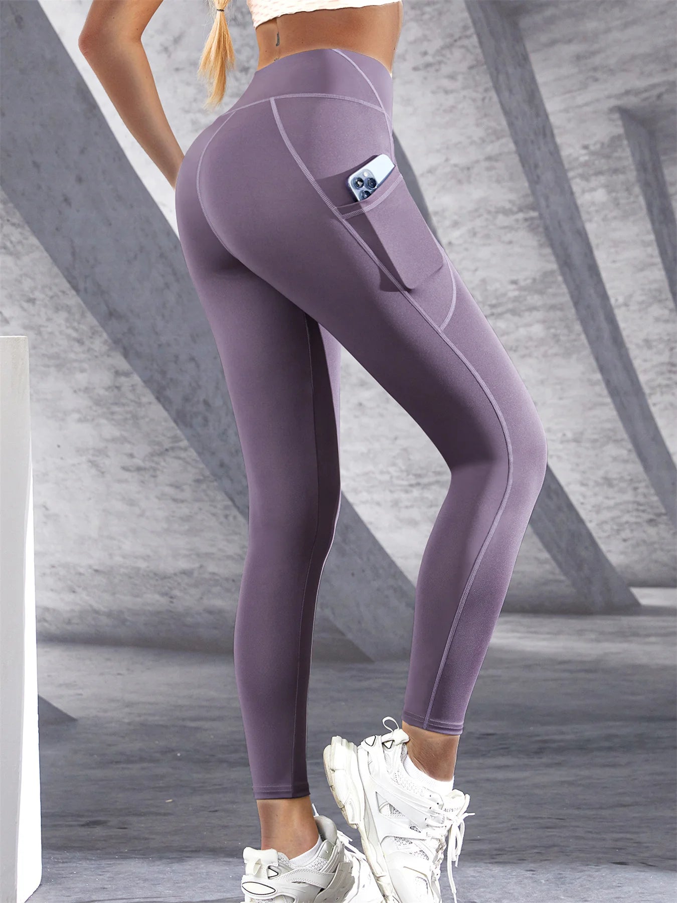 Stylish women's leggings with pockets in purple, perfect for workouts and daily wear