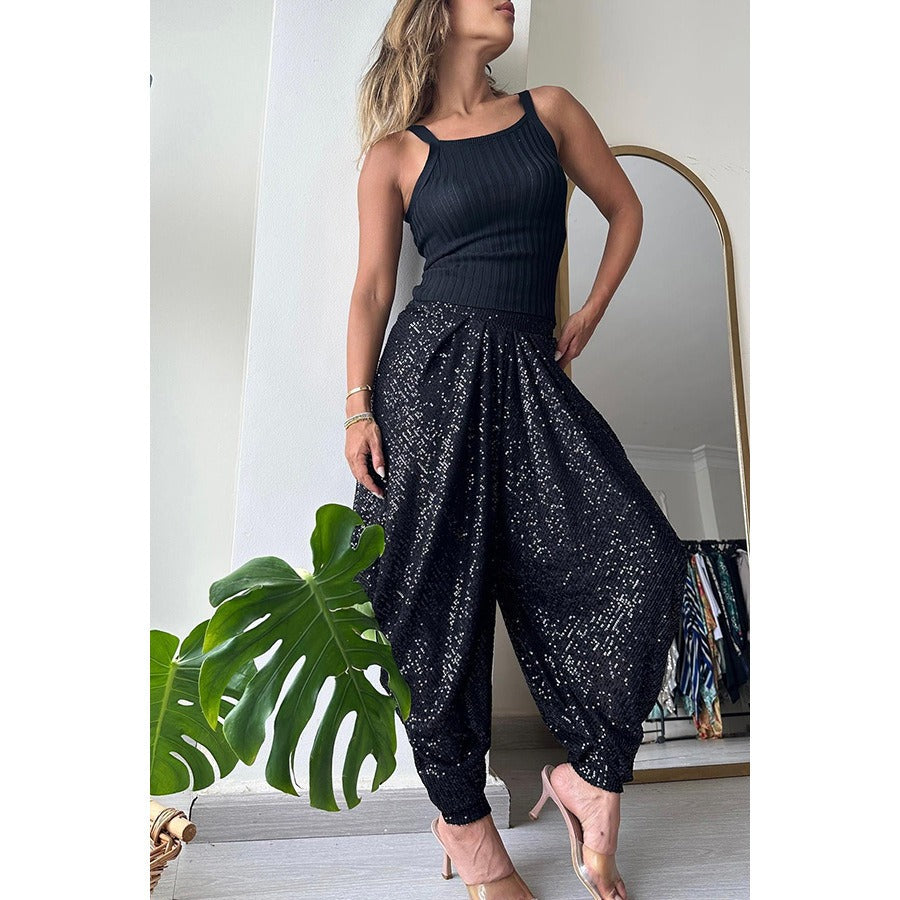 Trendy women's sequin harem pants with a stylish fit, perfect for a chic evening look
